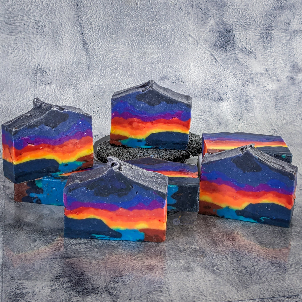 Set of landscape soaps resembling an ocean sunset with the top of the soap being pointed.