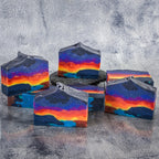 Set of landscape soaps resembling an ocean sunset with the top of the soap being pointed.