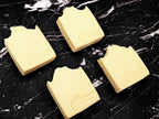 4 cream colored bastille-castile soaps on a black marble background. Each bar has 'The Loopy Spoonie' embossed/stamped in the bottom right of the soap bar